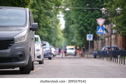 Close Up Of A Car Parked Illegally Against Traffic Rules On Pedestrian City Street Side