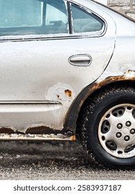 Close up of a car with rust in winter