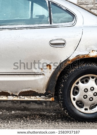 Close up of a car with rust in winter