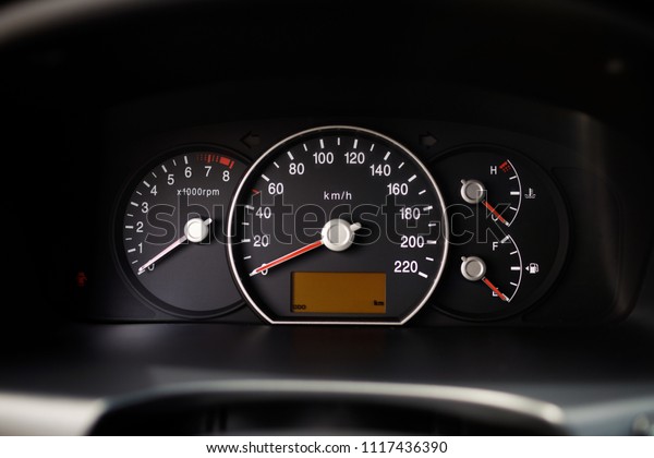 Close\
up of car speed meter. Shot of the dashboard a\
car.