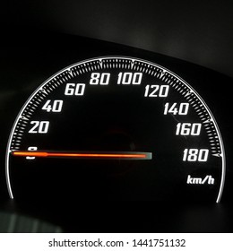 Close Up Of Car Speedometer Dashboard, Speed Metre Panel With Red Light Meter In Modern Panel Car