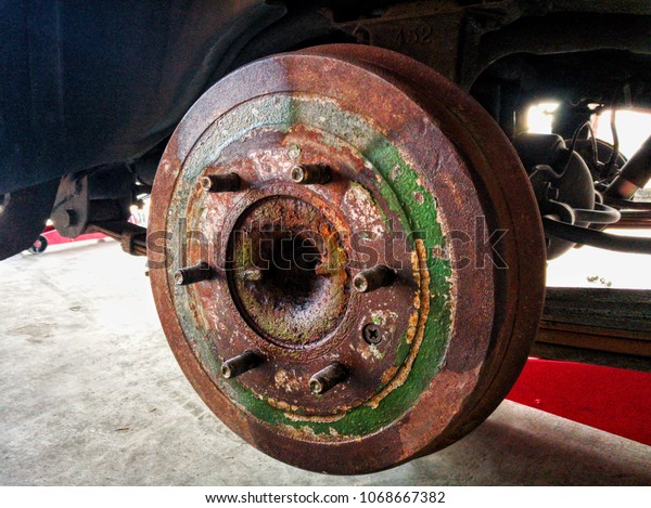 Close up car
wheel part background, maintenance wheel detail, repair car part in
garage, lifting car with
equipment