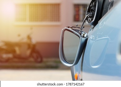 Close up car wing mirror, side view mirror broken from accident. Car insurance concept.