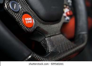 Close Up Carbon Fibre Steering Wheel With Red Start Stop Engine Button, Super Sport Car