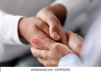 Close Up Caring African American Mother Holding Child Hands, Showing Love And Support, Black Mum Comforting, Caressing Kid, Children Protection Concept, Family Enjoying Moment Together