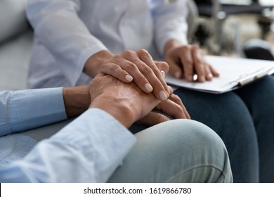 Close Up Caring Doctor Supporting Older Disabled Woman During Visit, Holding Hands, Giving Aid Psychological Help To Mature Patient, Expressing Empathy And Compassion, Disease, Healthcare