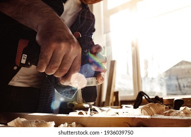 Close up of a carpenter drilling a hole in timber