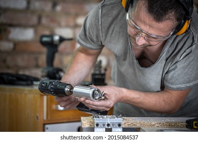 Close up a carpenter working with wood and building tools in house. - Shutterstock ID 2015084537