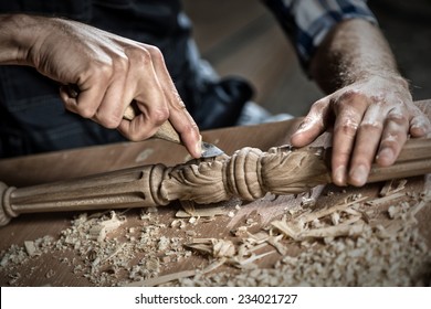 Close up carpenter's hands that work with cutter - Powered by Shutterstock