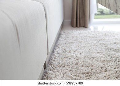 Close Up Of Carpet On The Floor With Sofa