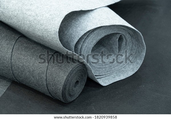 Close up of carpet rolls. Polyester or felt\
carpets background
