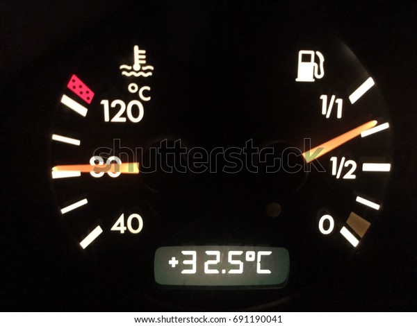 Close up car's gas-meter and temperature gauge
with black background