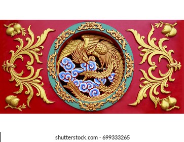 Close up carved phoenix on the wall sculpture in Chinese temple
