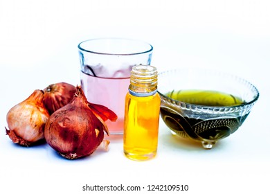 Close Up Of Caster Oil,onion Juice Mixture Used To Make Hair Stronger And Thicker Isolated On White.;