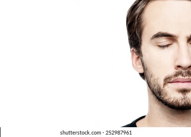 Close Up Of Casual Man Face Posing Over White