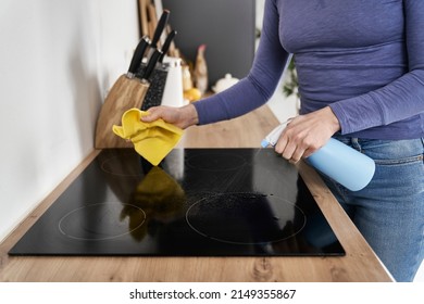 Close Up Of Caucasian Woman Cleaning Ceramic Glass Cooktop