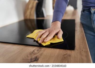 Close Up Of Caucasian Woman Cleaning Ceramic Glass Cooktop