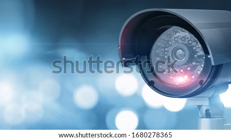 Close up of CCTV camera over defocused background with copy space
