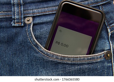 Close Up Of Cellphone In Pants Pocket Showing Screen With Zero Money Balance. Concept Of Being Economically Broken. Virtual Money In Your Pocket.