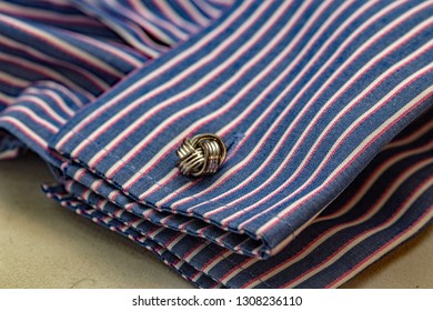 Close Up Of Celtic Knot Design Cufflink And Double Cuff Stripy Fashion Shirt