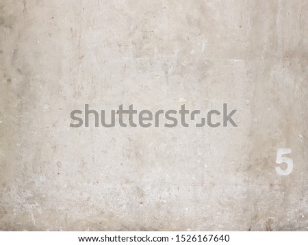 close up cement wall textrue with mark number 5