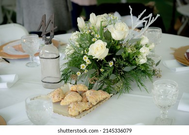 Close Up Of Centerpiece And Pastries At Gala Dinner Party.