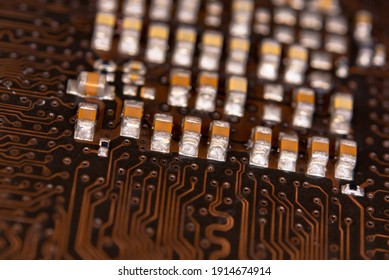 Close Up Ceramic Capacitors On Electronic Circuit Board 