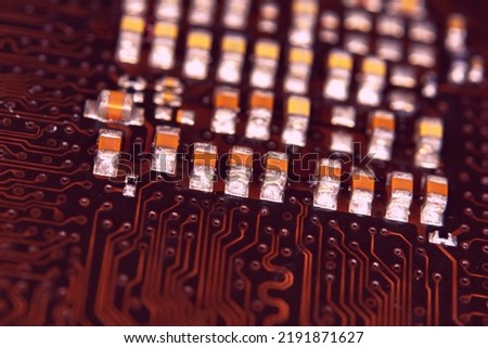 close up ceramic capacitors on electronic circuit board 