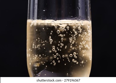 Close Up Champagne Bubble In Glass On Black Background