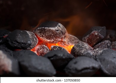 Close up of charcoal briquettes ready for barbecue grill.