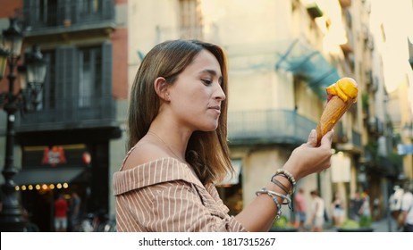 Close Up Cheerful Woman Licking Icecream Outdoor. Cute Girl Eating Melting Ice Cream In Slow Motion. Portrait Of Laughing Woman Posing On Camera With Ice Cone.