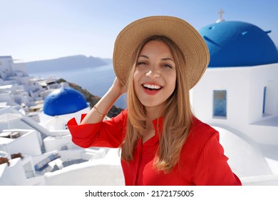 Close Up Of Cheerful Young Woman In Oia Picturesque Greek Village Of Santorini Island. Portrait Of Young Woman Having Fun In Greece, Europe.