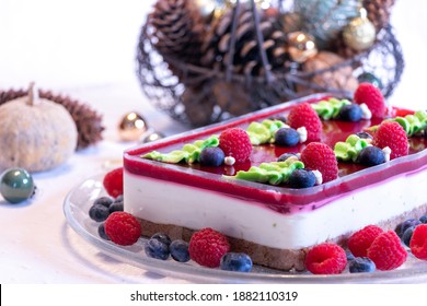 Close Up Of Cheese Cake With Berries, Red And Blue Fruits For Special Occasion Dinner With Friends And Family For Christmas And New Year Party. 