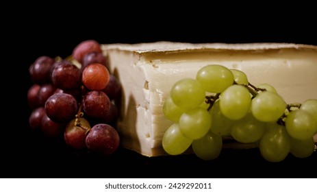 Close up of cheese with grapes