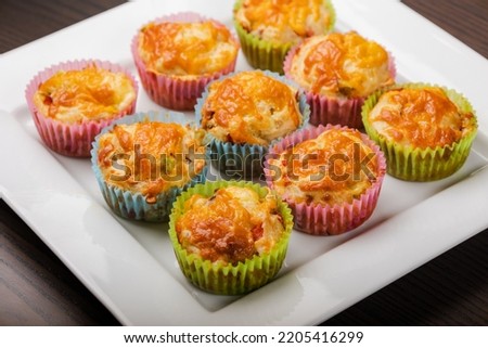 close up of cheesy savory muffins with vegetable 