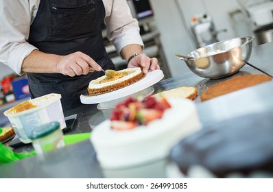 Close Up Of Chef Decorating Cake