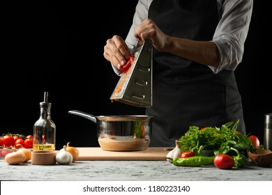 Close the chef's hands, preparing an Italian tomato sauce for macaroni.pizza. The concept of the Italian cooking recipe - Shutterstock ID 1180223140