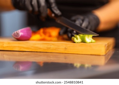 Close up of chef's hands slicing celery on a wooden board, preparing ingredients for a vibrant salad, emphasizing culinary precision and fresh, healthy cuisine - Powered by Shutterstock