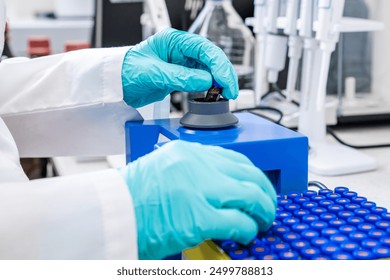 Close up of a chemist shaking samples using a vortex mixer before HPLC analysis in the laboratory  - Powered by Shutterstock