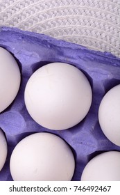 Close up of Chicken eggs, Blue package with eggs, Eggs in old tray