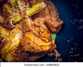 Close Up Of Chicken Rendang In Wok. Rendang is A Spicy Meat Dish Which Originated From The Minangkabau Ethnic And Now Commonly Served Ay Malaysia And Indonesia 