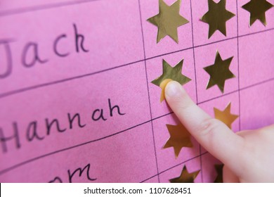 Close Up Of Child With Reward Chart