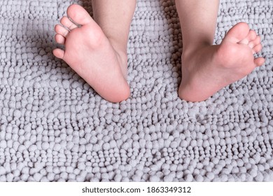  Close up children's legs on a fluffy carpet
