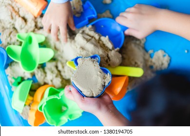 Close Up Child's Hand With Sand Playing Sand At Home.Concept For Executive Functions On Kid When Play Sand.