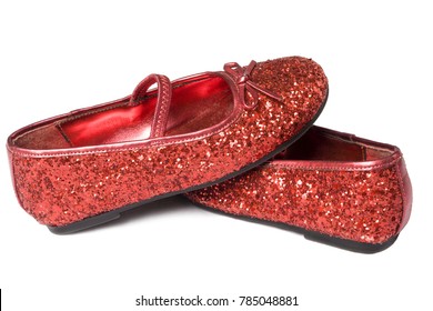 Close Up Of Child's Ruby Red Glitter Slipper Isolated On White Backgroud