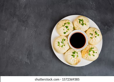 Close Up Of Chinese Steamed Dumplings On Gray Concrete Background. Flat Lay, Top View, Overhead, Mockup, Template. Asian Food Concept. Traditional Food For Chinese New Year Celebration