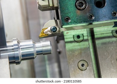 Close Up Of The Chip Insert For Threading Process On Machining Center. The Hi-technology Metal Working Processing By CNC Turning Machine .