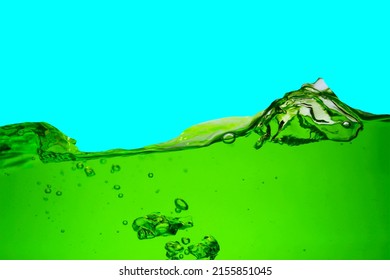 Close Up Of Chlorophyll Water Isolated On Blue Background.