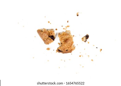 Close Up Of Chocolate Chip Cookie Pieces With Crumbs Isolated On White Background