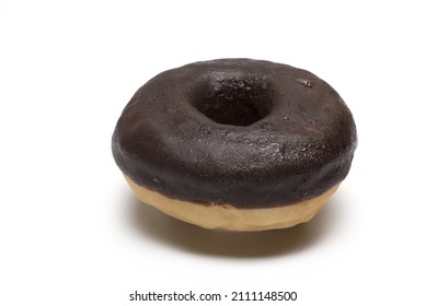 Close Up Of Chocolate Covered Donut On White Background